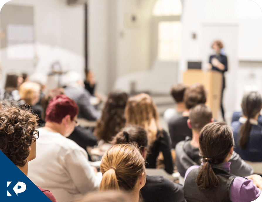 A woman presenting at a conference